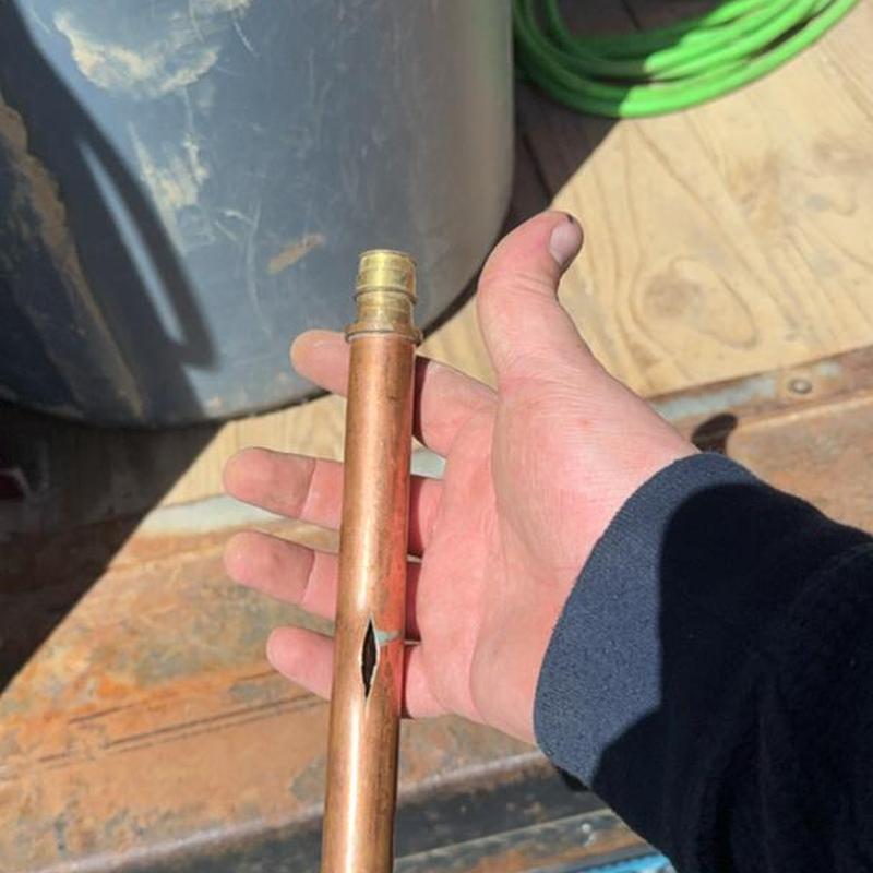 Copper water pipe with split hole damage in hand