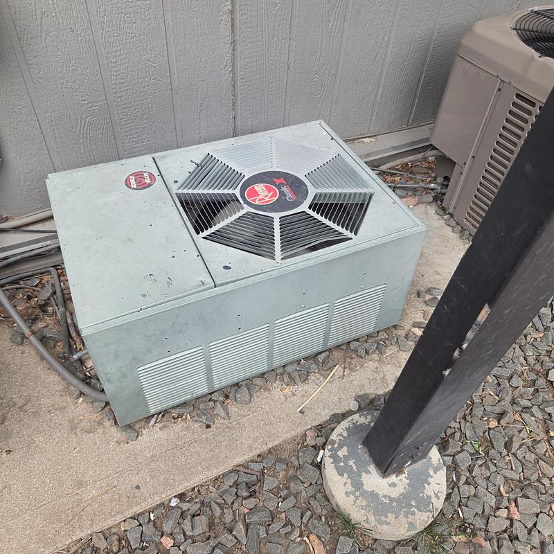 Rheem air conditioner condenser unit on concrete pad Rheem air conditioner condenser unit on concrete pad