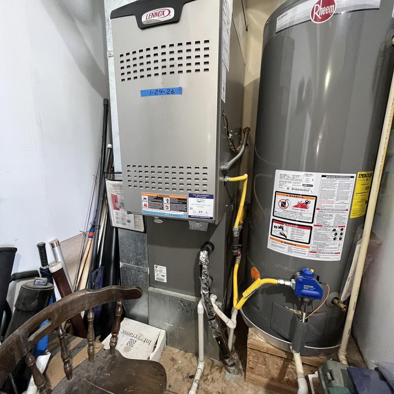Furnace and water heater system in utility room
