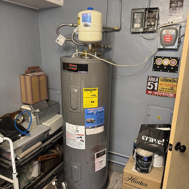 Electric water heater with expansion tank installed