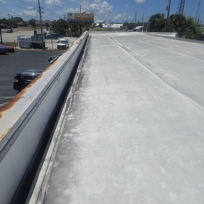 Commercial flat roof surface showing wear and damage Commercial flat roof surface showing wear and damage