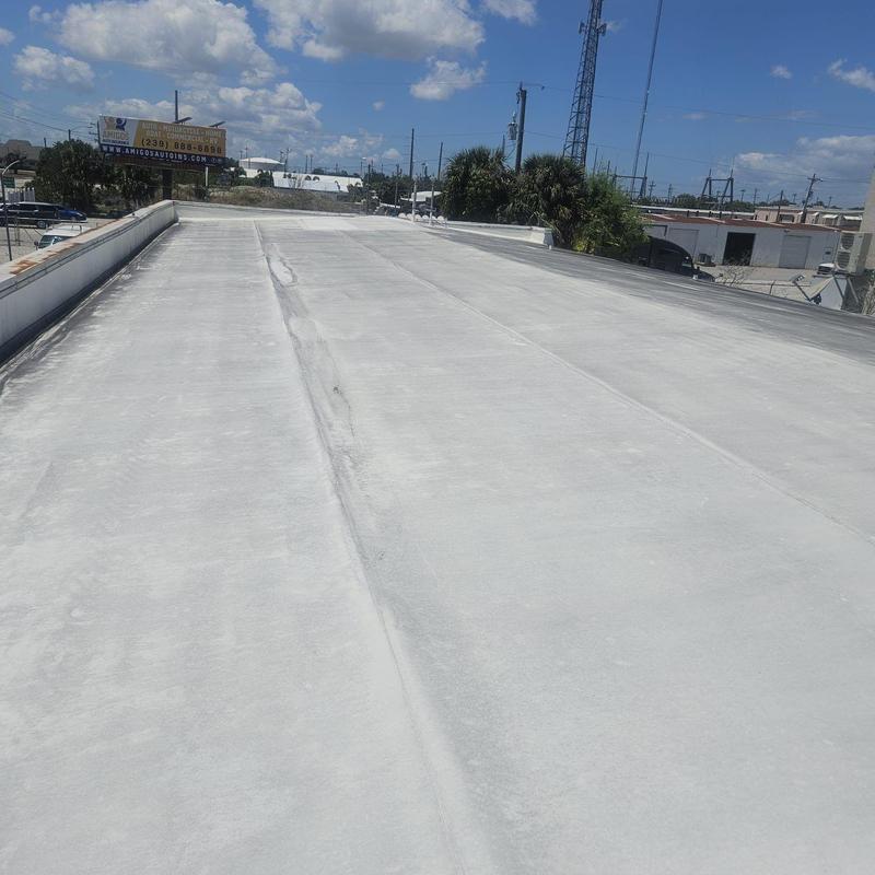 Commercial flat roof showing visible wear and damage Commercial flat roof showing visible wear and damage
