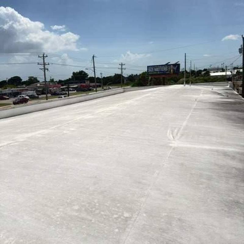 Flat commercial roof surface showing wear and damage Flat commercial roof surface showing wear and damage