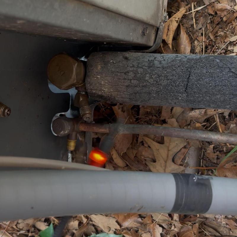 Suction line Schrader core leak detection with torch flame Suction line Schrader core leak detection with torch flame