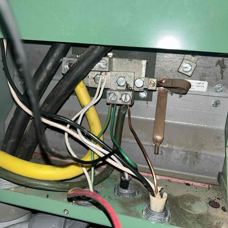Electrical panel grounding and wiring connections close-up