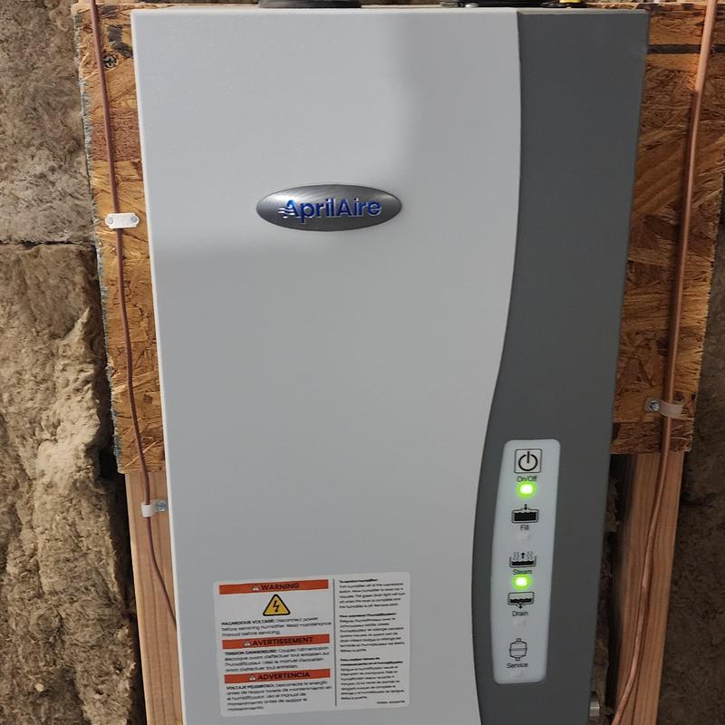 Aprilaire steam humidifier with indicator lights on panel