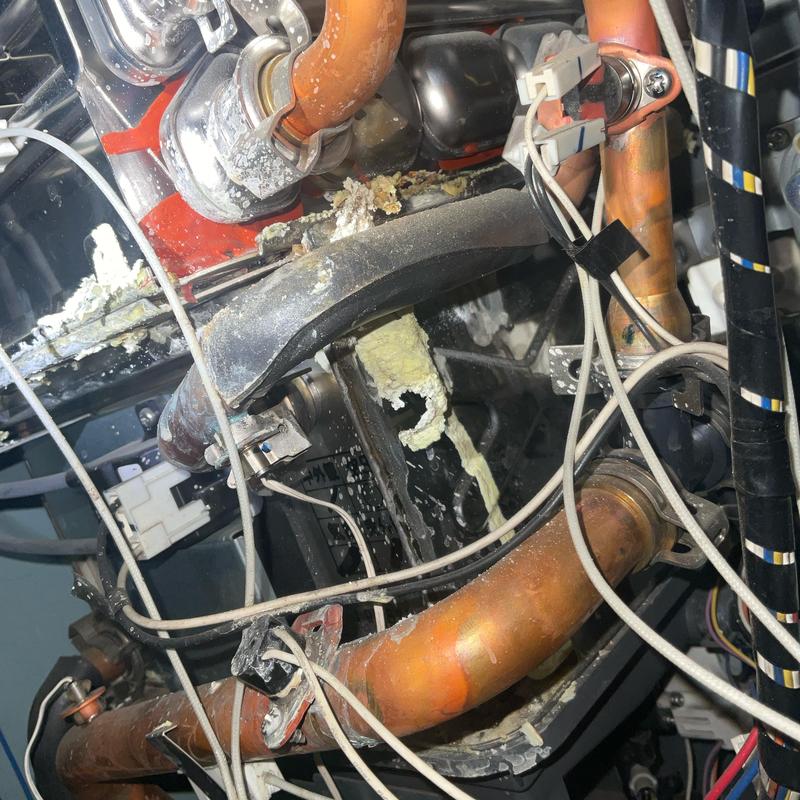Tankless water heater heat exchangers with corrosion damage