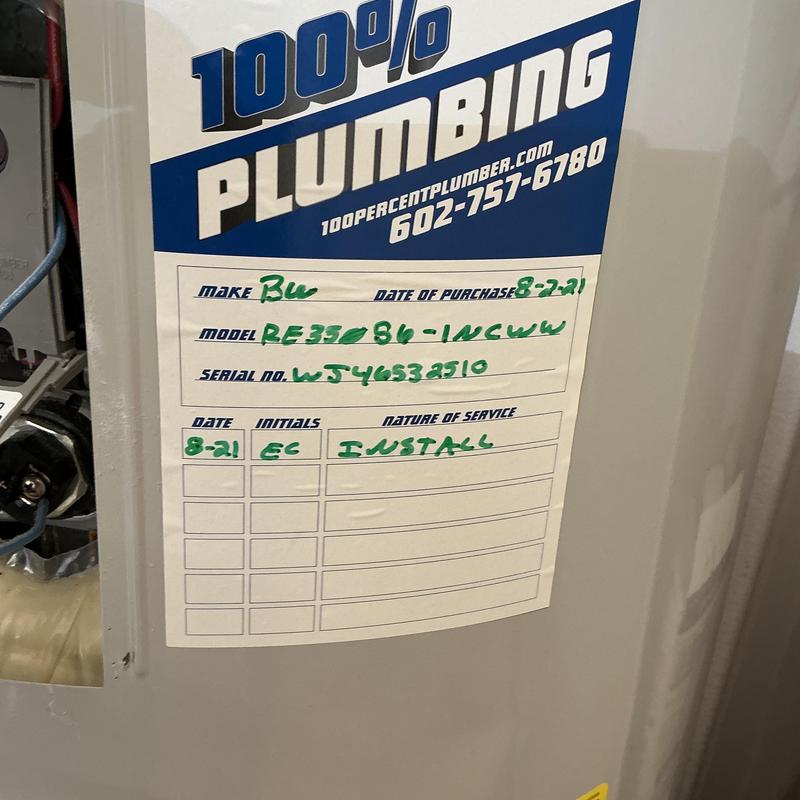 Water heater with installation label and company sticker