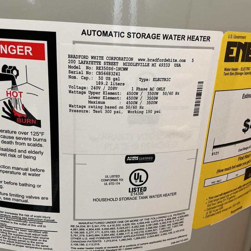 Electric water heater label with specifications and warnings