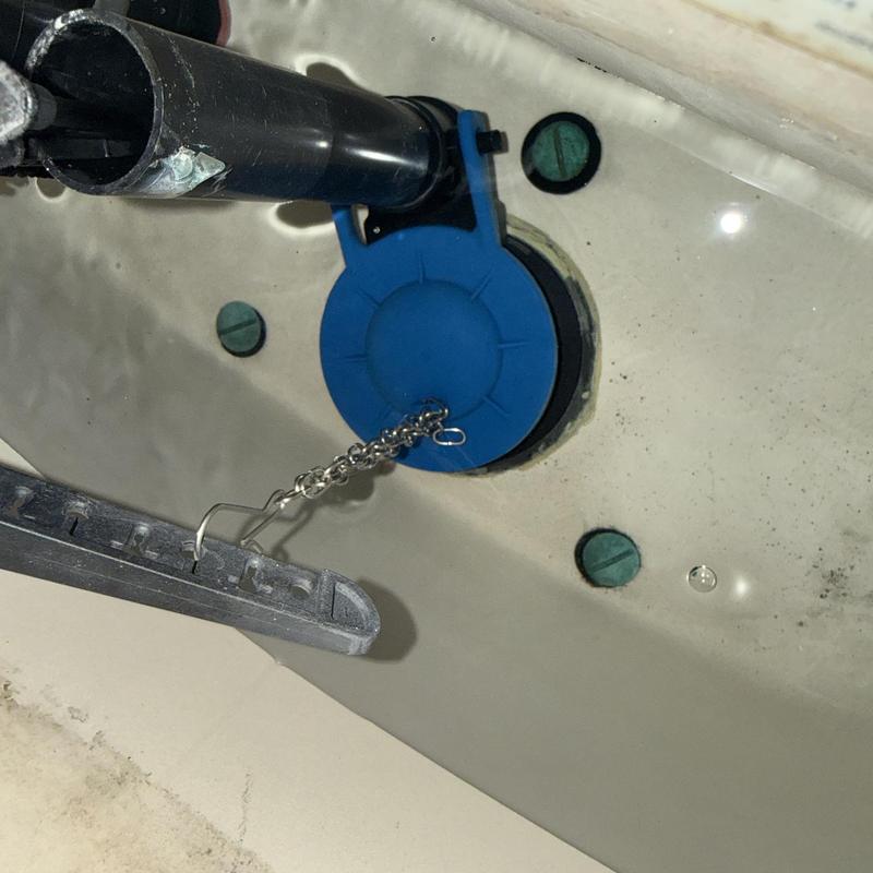 Toilet flapper valve and chain inside toilet tank