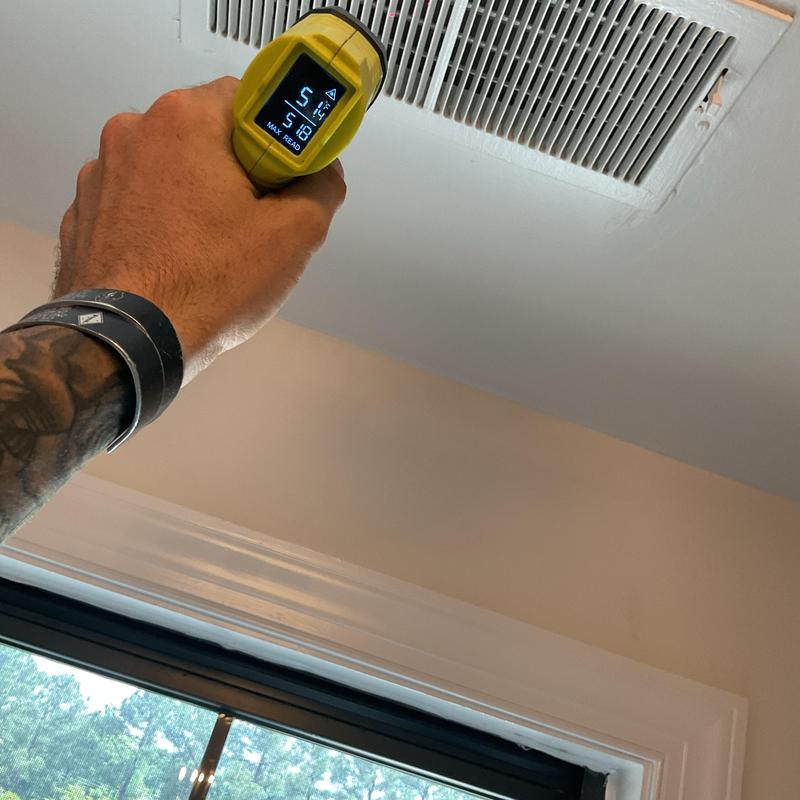 HVAC air vent temperature check with infrared thermometer HVAC air vent temperature check with infrared thermometer