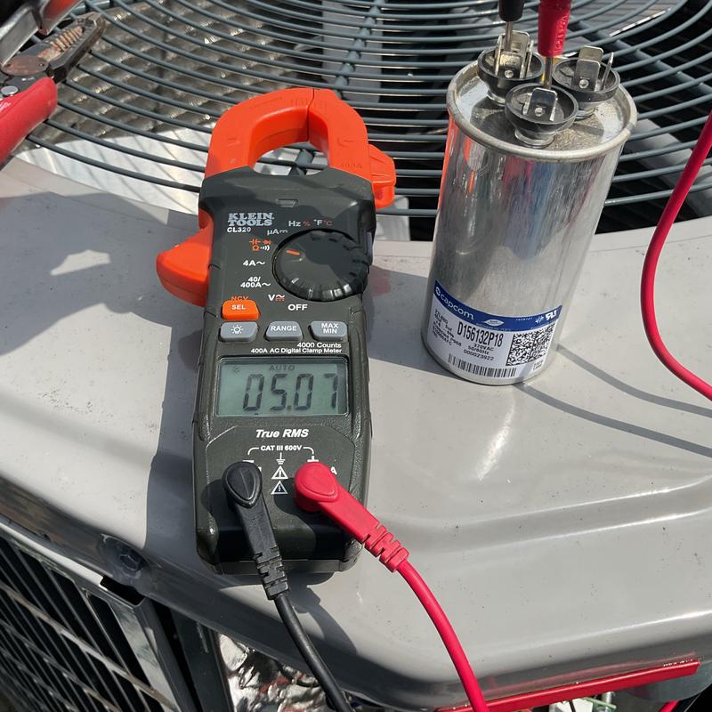 AC capacitor testing with digital clamp meter on unit AC capacitor testing with digital clamp meter on unit