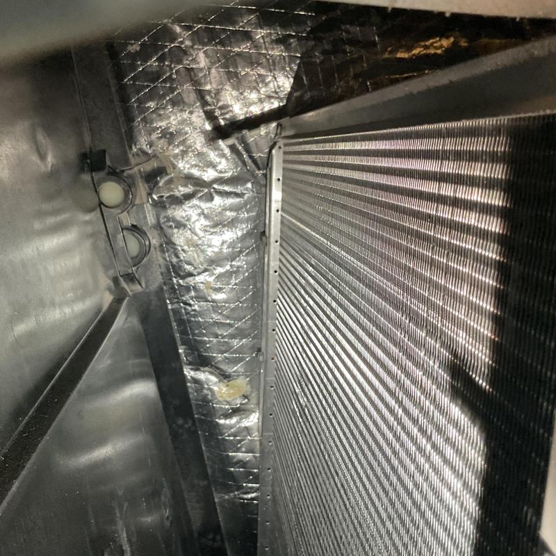 Evaporator coil inside HVAC unit with foil insulation Evaporator coil inside HVAC unit with foil insulation