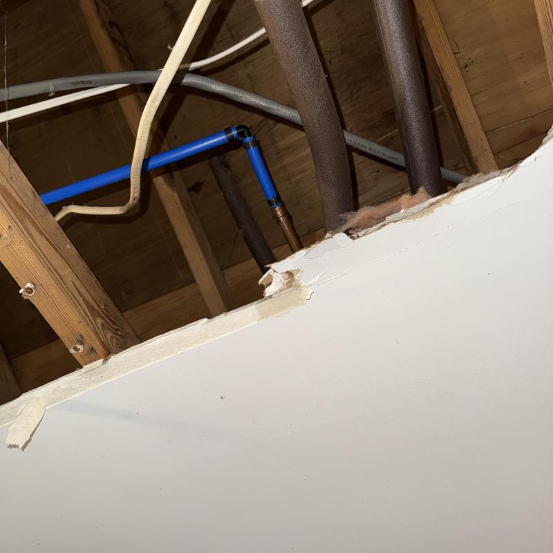 Water line with SharkBite leak repairs in ceiling cavity Water line with SharkBite leak repairs in ceiling cavity