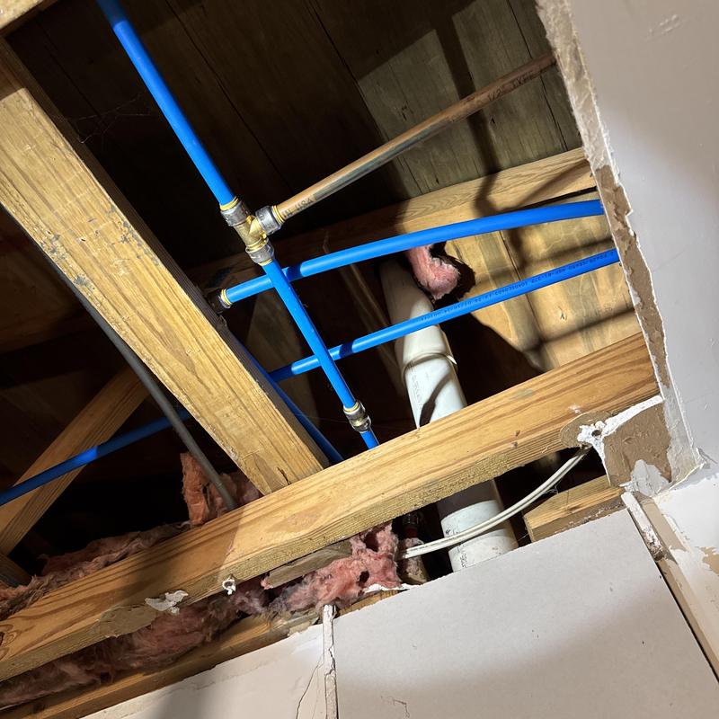Water line with SharkBite fittings in attic ceiling framing Water line with SharkBite fittings in attic ceiling framing
