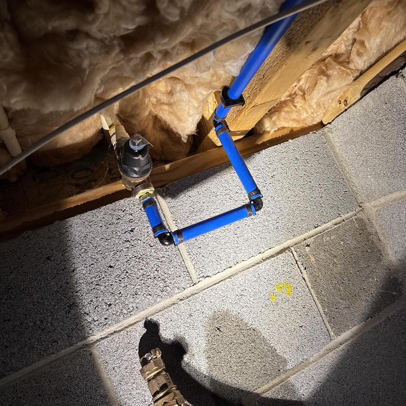 Single canister water filter and blue piping installation Single canister water filter and blue piping installation
