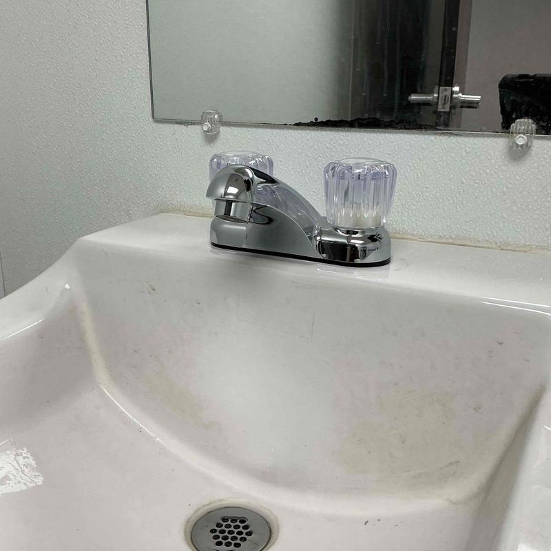 Bathroom sink faucet with clear knobs installed