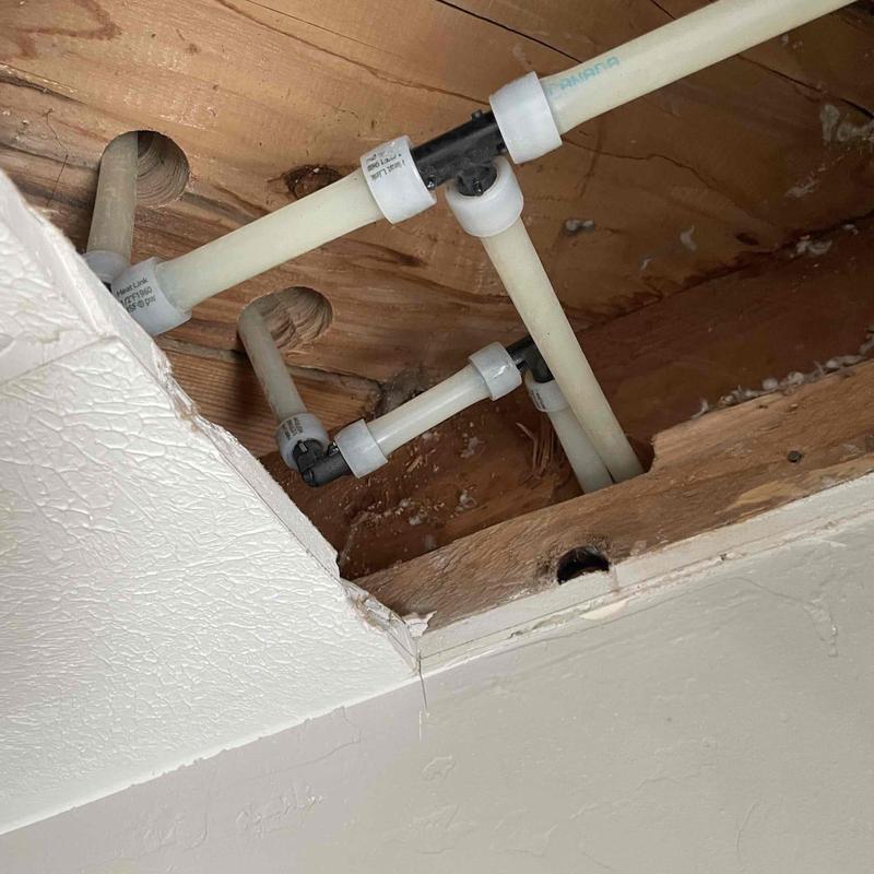 Potable water re-pipe with PEX piping in ceiling cavity Potable water re-pipe with PEX piping in ceiling cavity