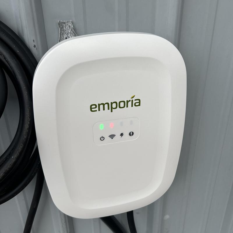 Level 2 EV charger wall unit with indicator lights