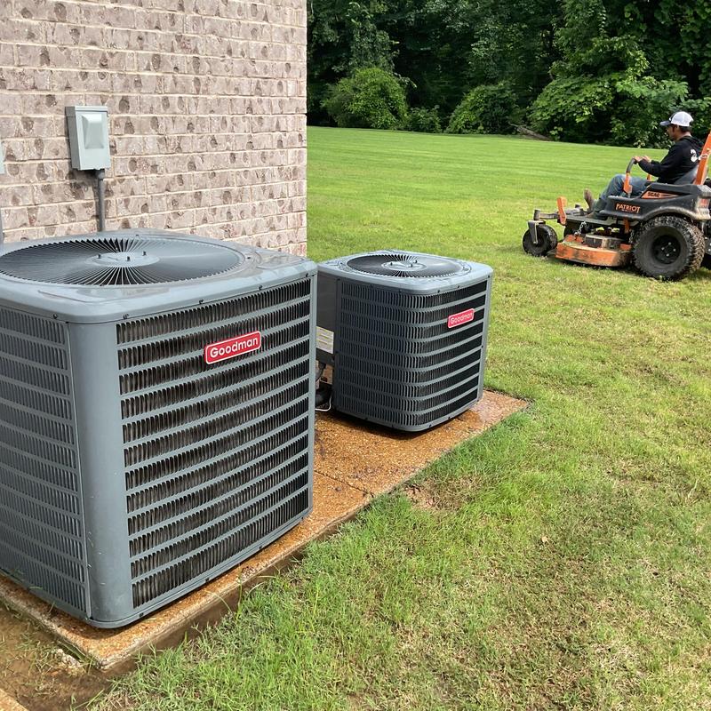 Goodman condenser units outside residential home Goodman condenser units outside residential home