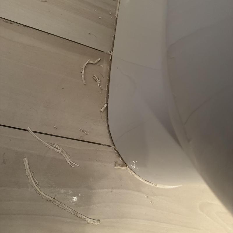 Toilet base recaulked after wax ring replacement