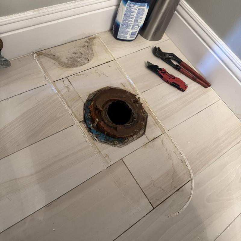 Toilet flange removal with tools on laminate floor