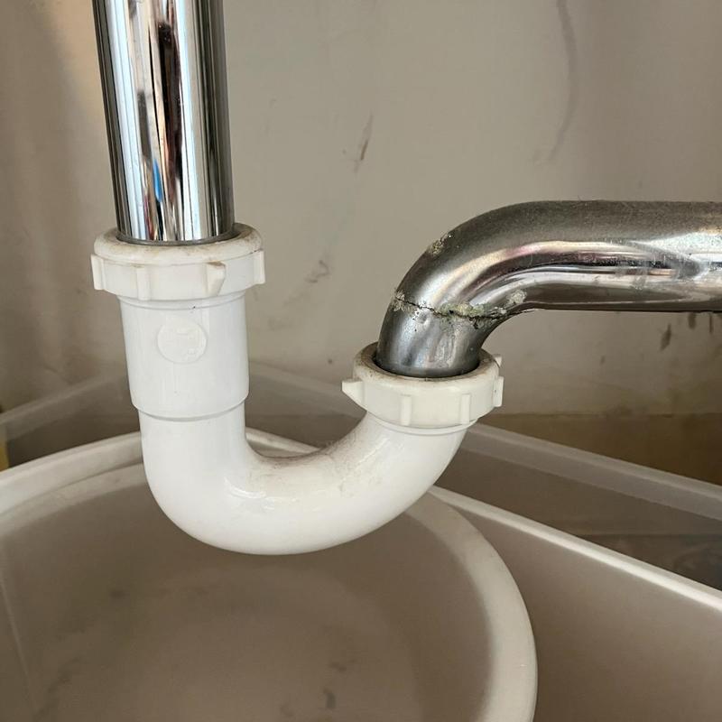 P-trap drain pipe joint under sink in residence