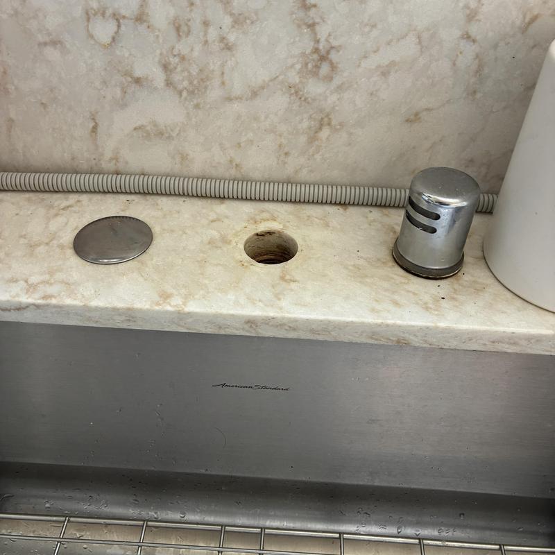 Toilet tank horizontal flush button installation hole