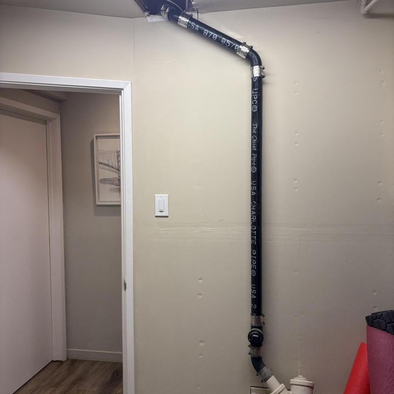 Cast iron drain pipe installation inside wall cavity