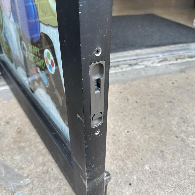 Bottom flush bolt on glass door lock system