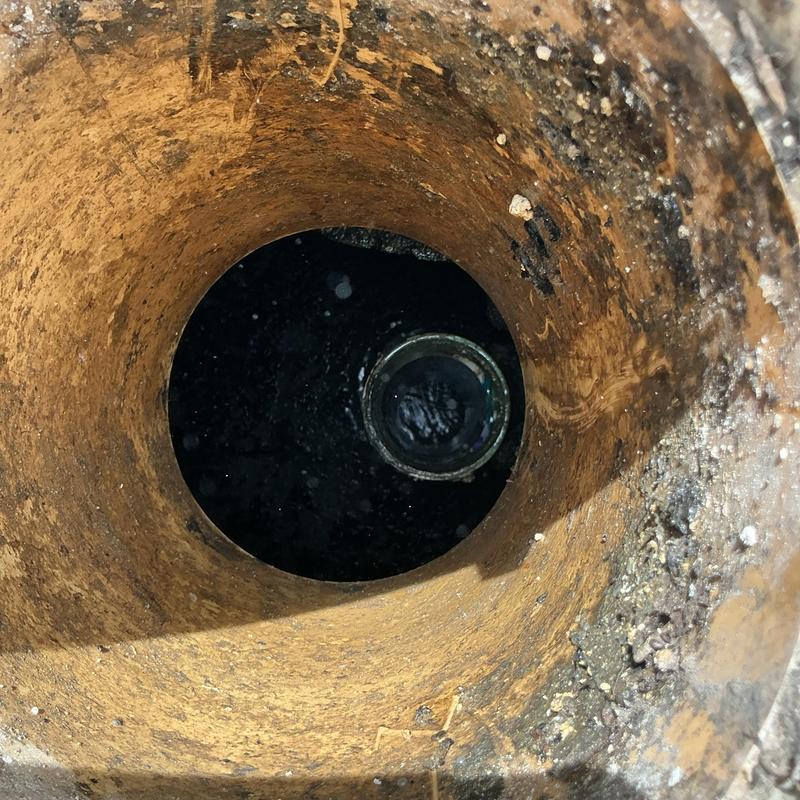 Septic tank interior showing liquid contents and walls