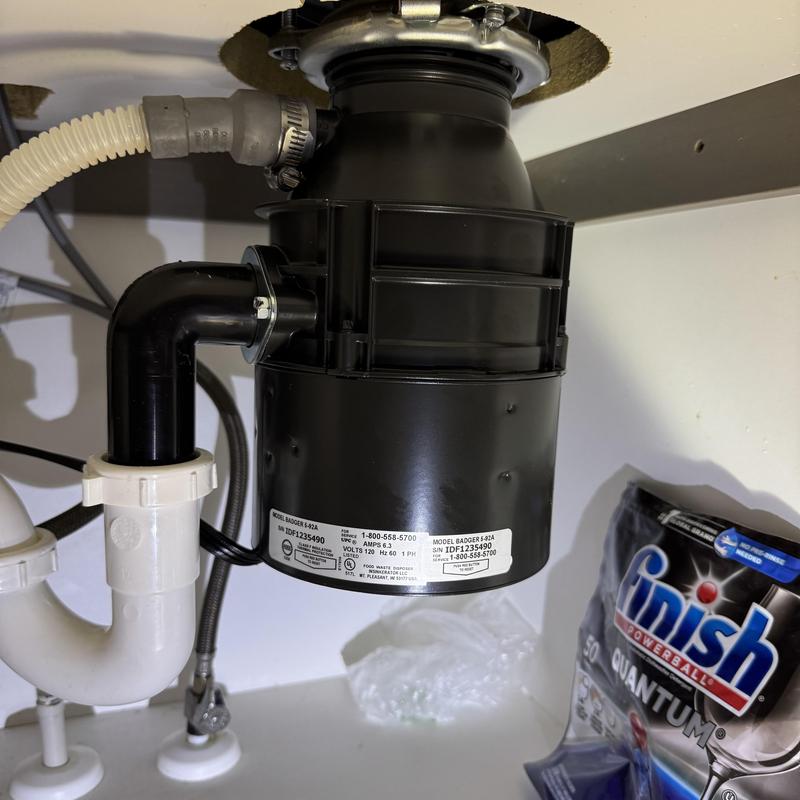 Garbage disposal unit under kitchen sink installation