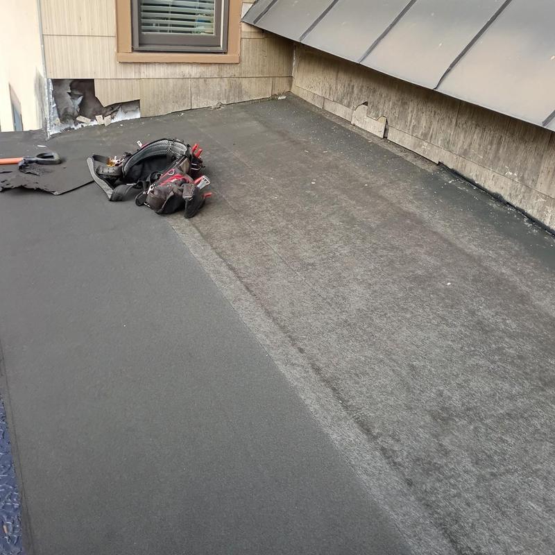 EPDM rubber flat roof with tools on surface EPDM rubber flat roof with tools on surface