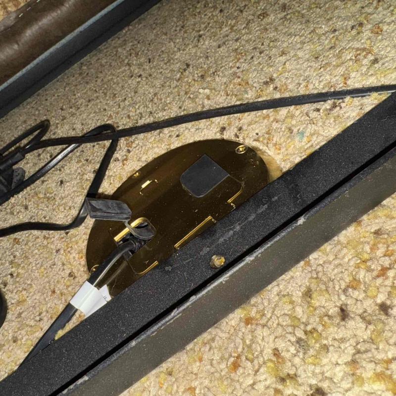 Floor outlet power installation with wiring on carpet