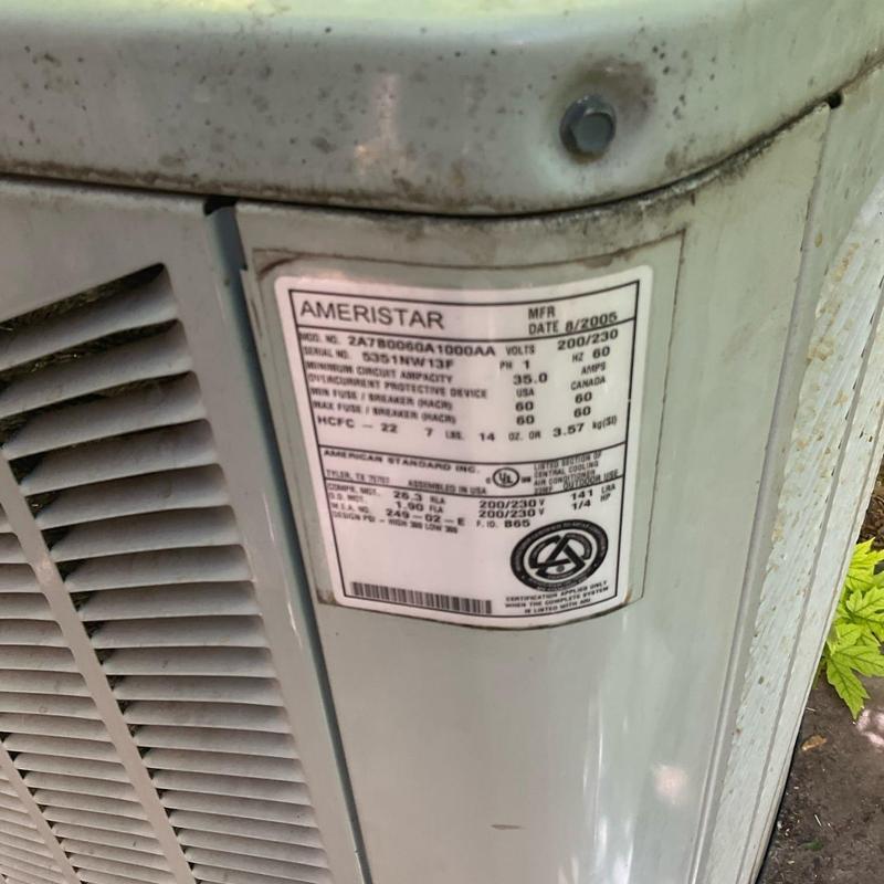 Air conditioner condenser unit label and vents close-up