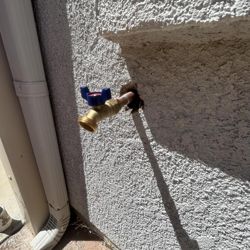 Quarter-turn 12 hose bib installed on stucco wall