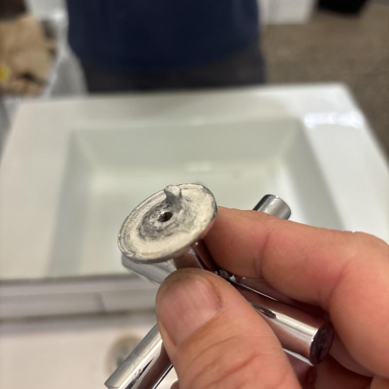 Faucet aerator clogged with mineral deposits close-up