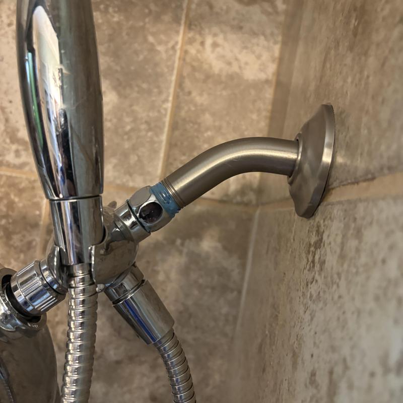 Showerhead arm loose connection on tiled wall