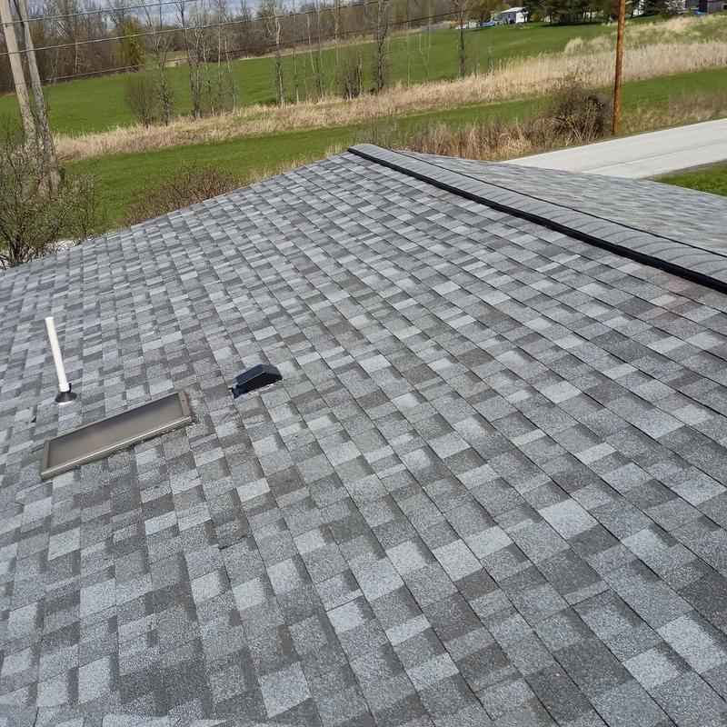 Asphalt shingle roof with vent and skylight installation Asphalt shingle roof with vent and skylight installation