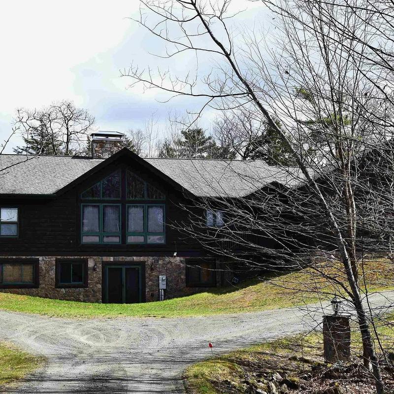 Architectural asphalt shingle roof on rustic home Architectural asphalt shingle roof on rustic home