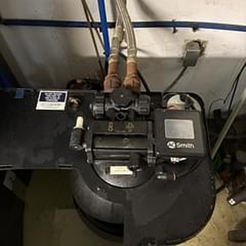 Water softener control valve and pipes in basement