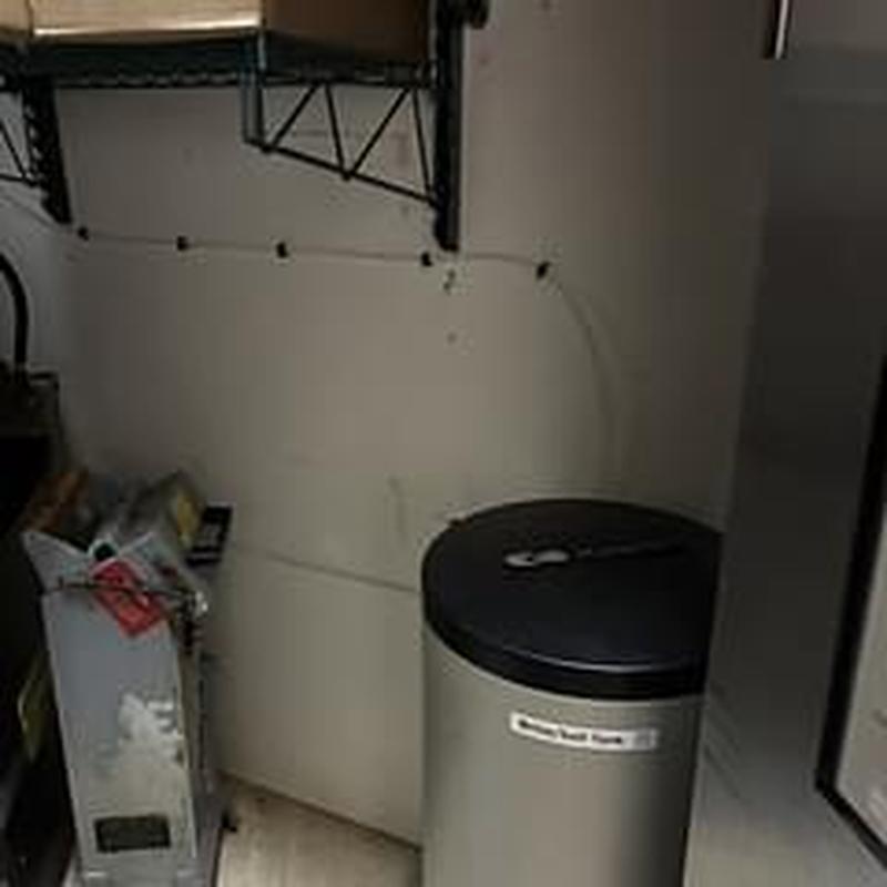 Brine tank relocation in utility closet