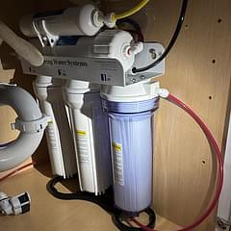 Reverse osmosis water filtration system installation under sink Reverse osmosis water filtration system installation under sink