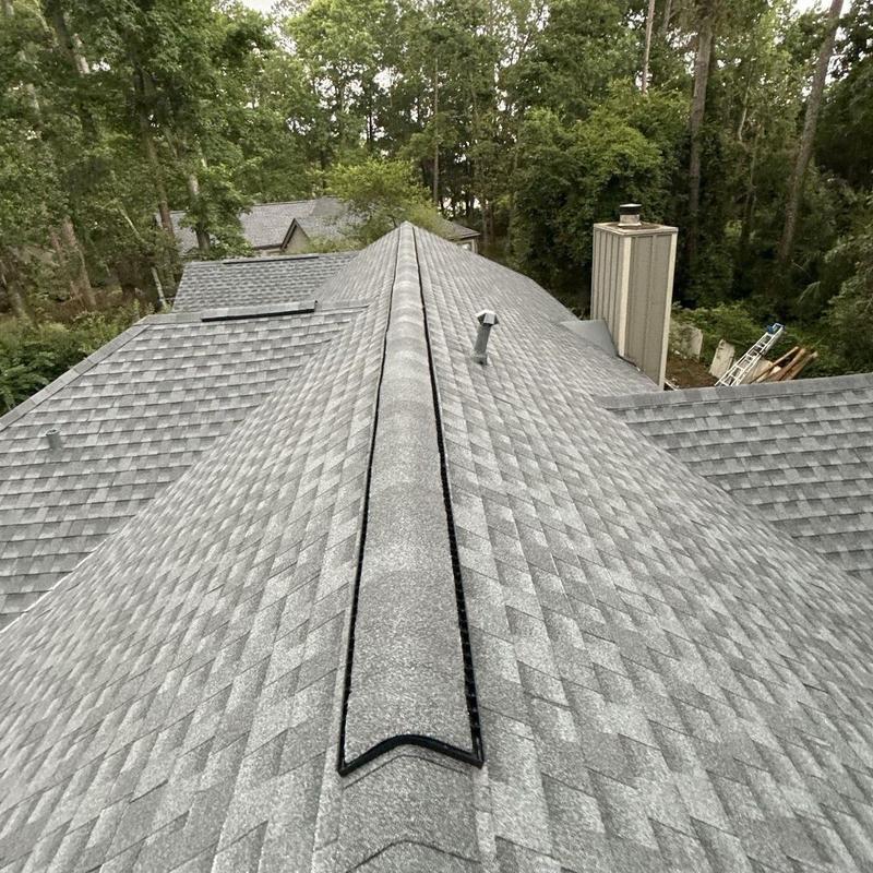 Architectural shingle roof with ridge vent installation Architectural shingle roof with ridge vent installation