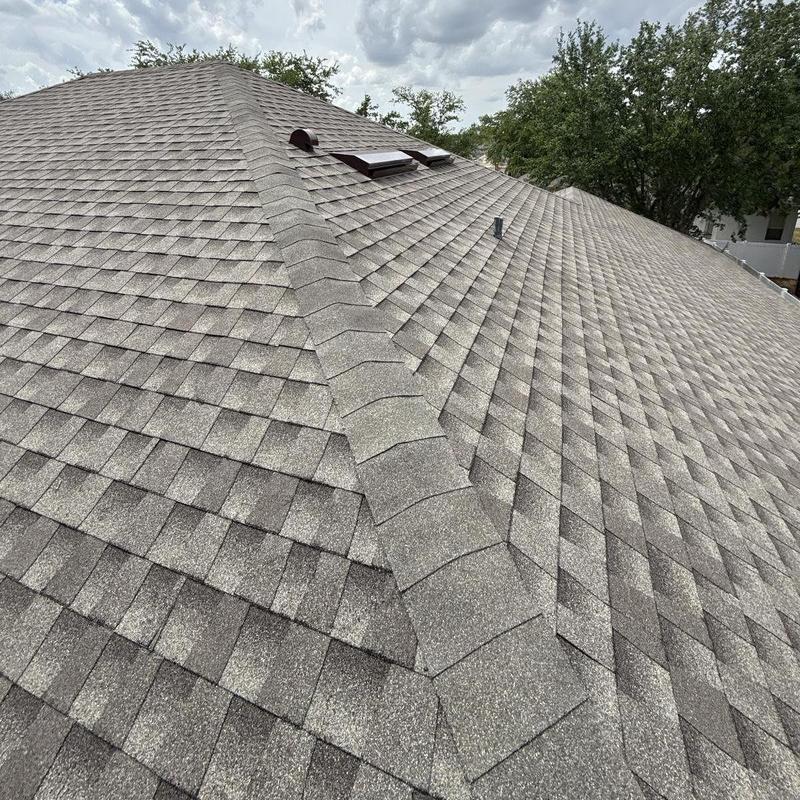 Architectural shingle roof with ridge vent installation Architectural shingle roof with ridge vent installation