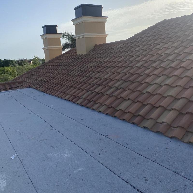 Eagle concrete tile roof with modified bitumen flat section Eagle concrete tile roof with modified bitumen flat section