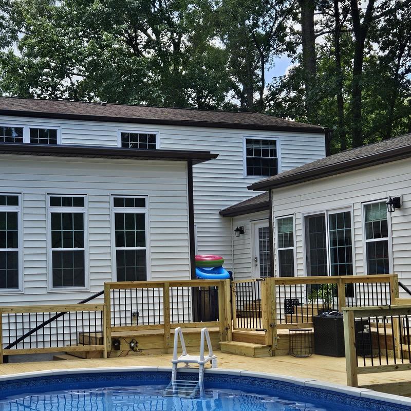 Vinyl siding installation with poolside deck in Raleigh Vinyl siding installation with poolside deck in Raleigh