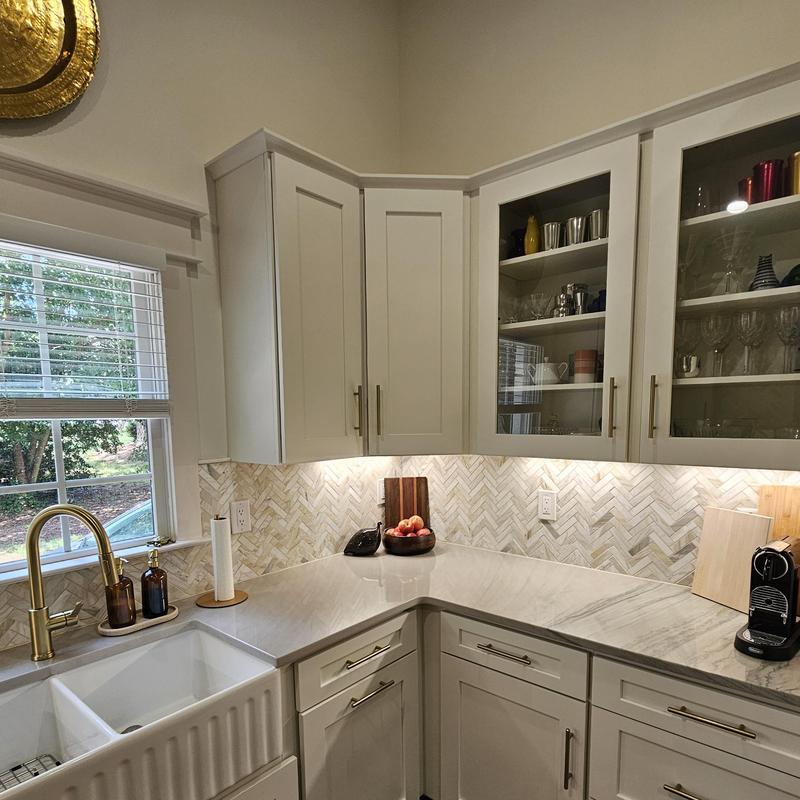 Kitchen cabinets and marble countertops with gold faucet Kitchen cabinets and marble countertops with gold faucet