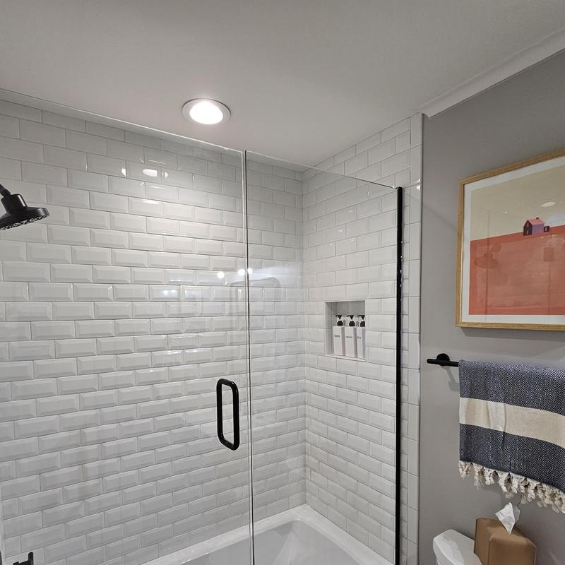 Shower enclosure with white subway tile walls Shower enclosure with white subway tile walls