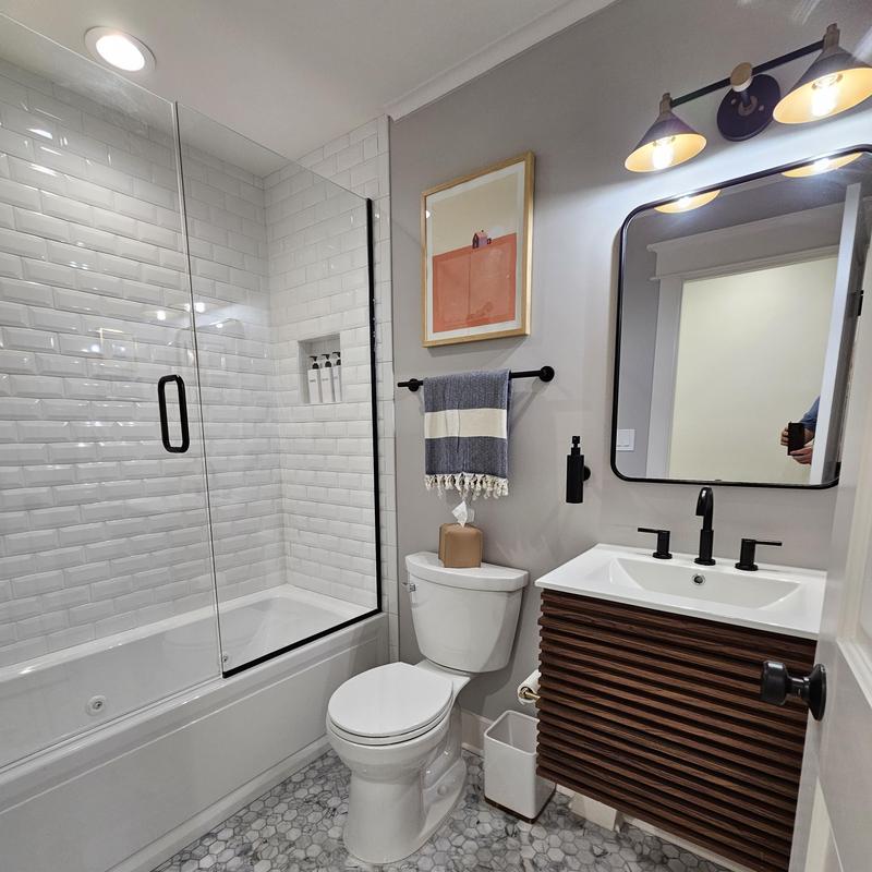 Bathtub shower enclosure with tile walls in bathroom Bathtub shower enclosure with tile walls in bathroom